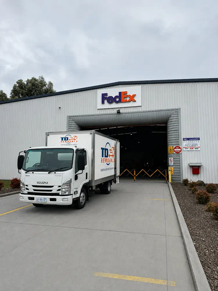 Removal truck outside FedEx depot entrance